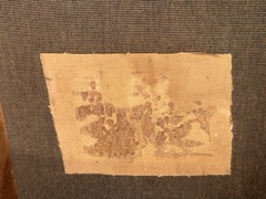  Remnant of original paper label attached to the original canvas is attached to the new canvas support. 